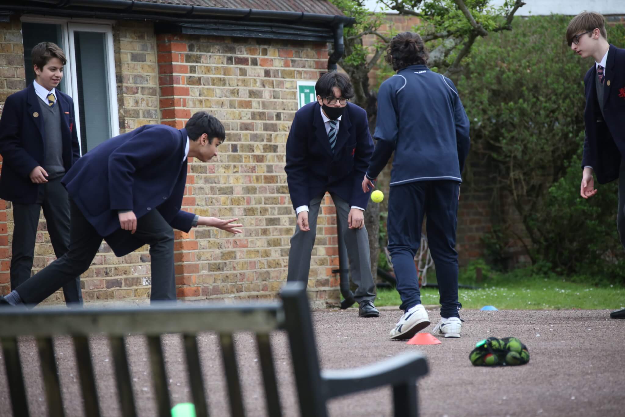 Pupils playing Four Square on John Lyon's 145th anniversary